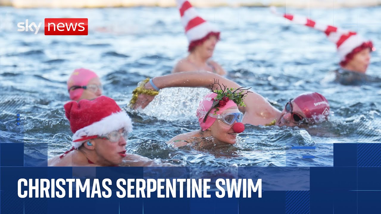 Swimmers compete in the Serpentine Christmas Day Race in Hyde Park