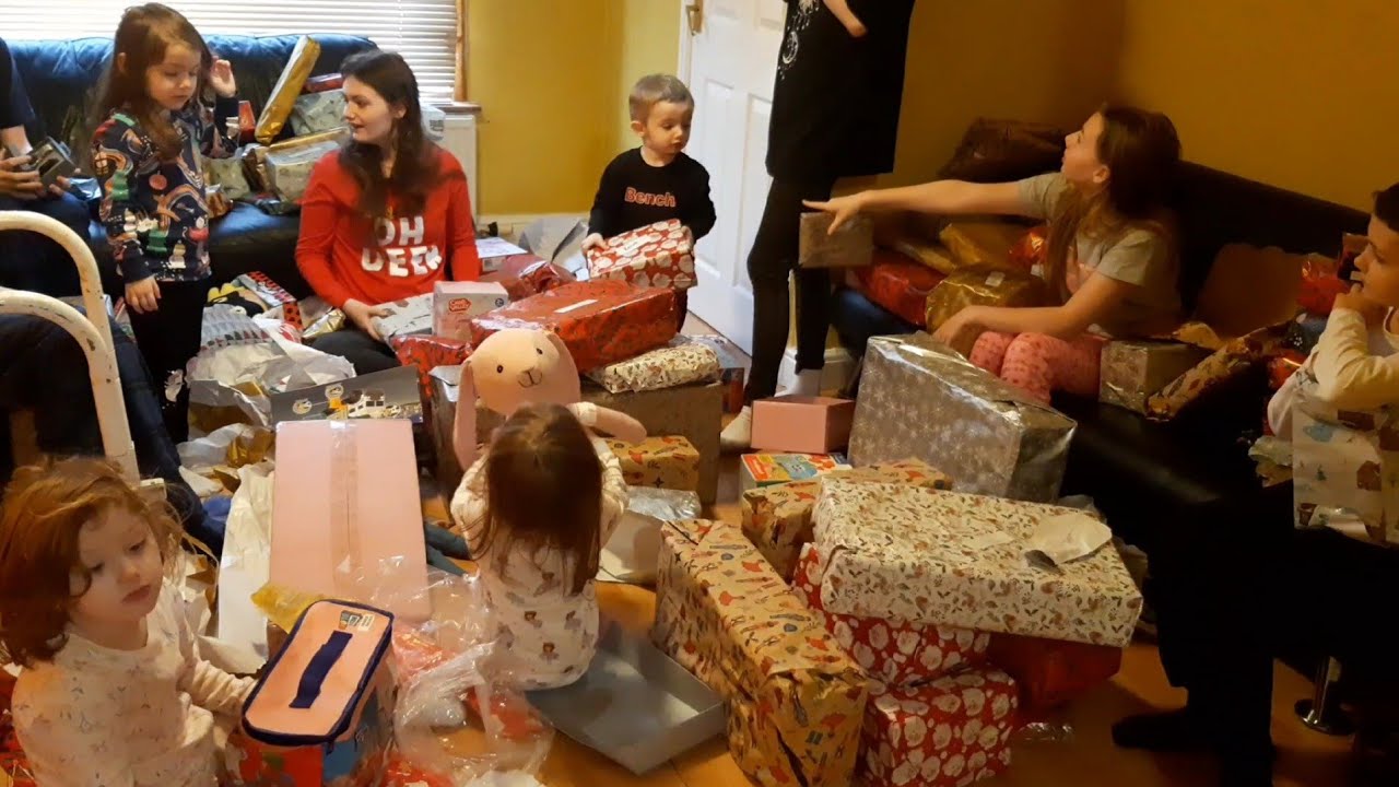Christmas morning, 2023. Opening presents with 10 children.