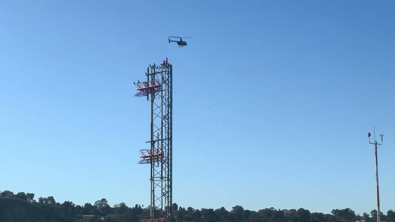2x R66 Robinson Helicopters taking off from Torrance Airport