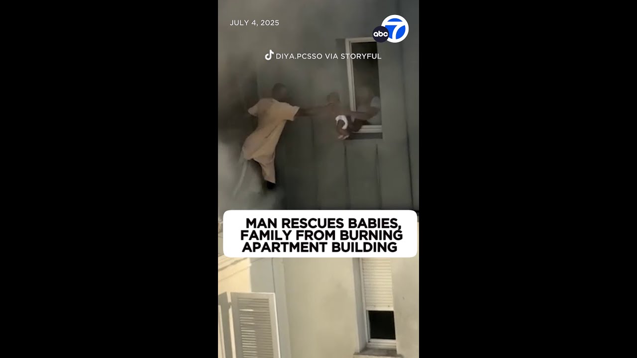 Video shows man rescue babies from 6th floor of burning building