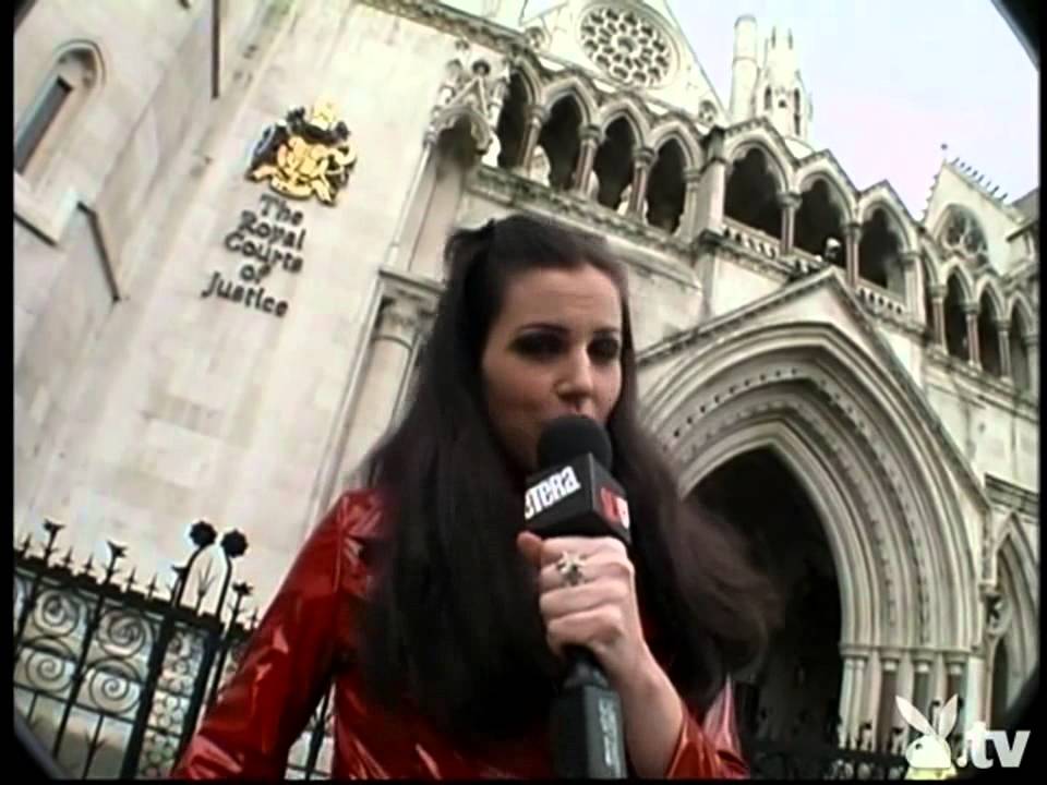Reporter in shiny red pvc mac