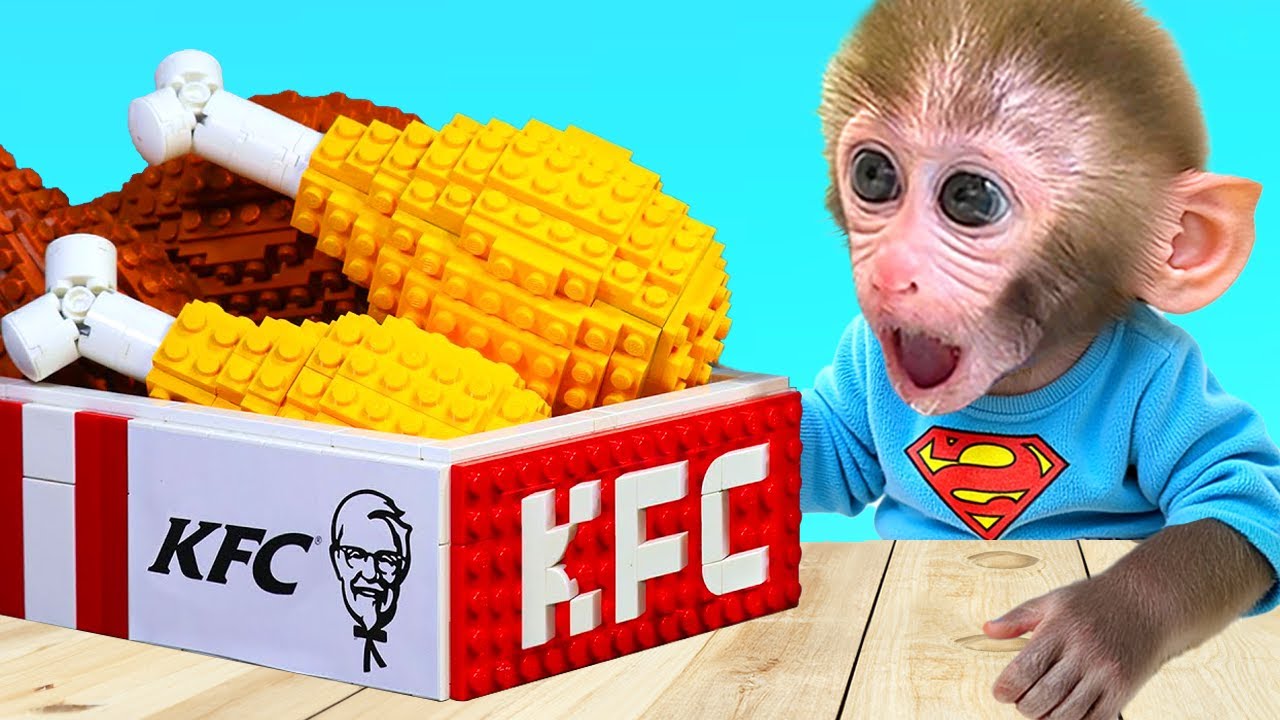 Monkey Baby Bon Bon with the ducling work together on a cardboard puzzle challenge
