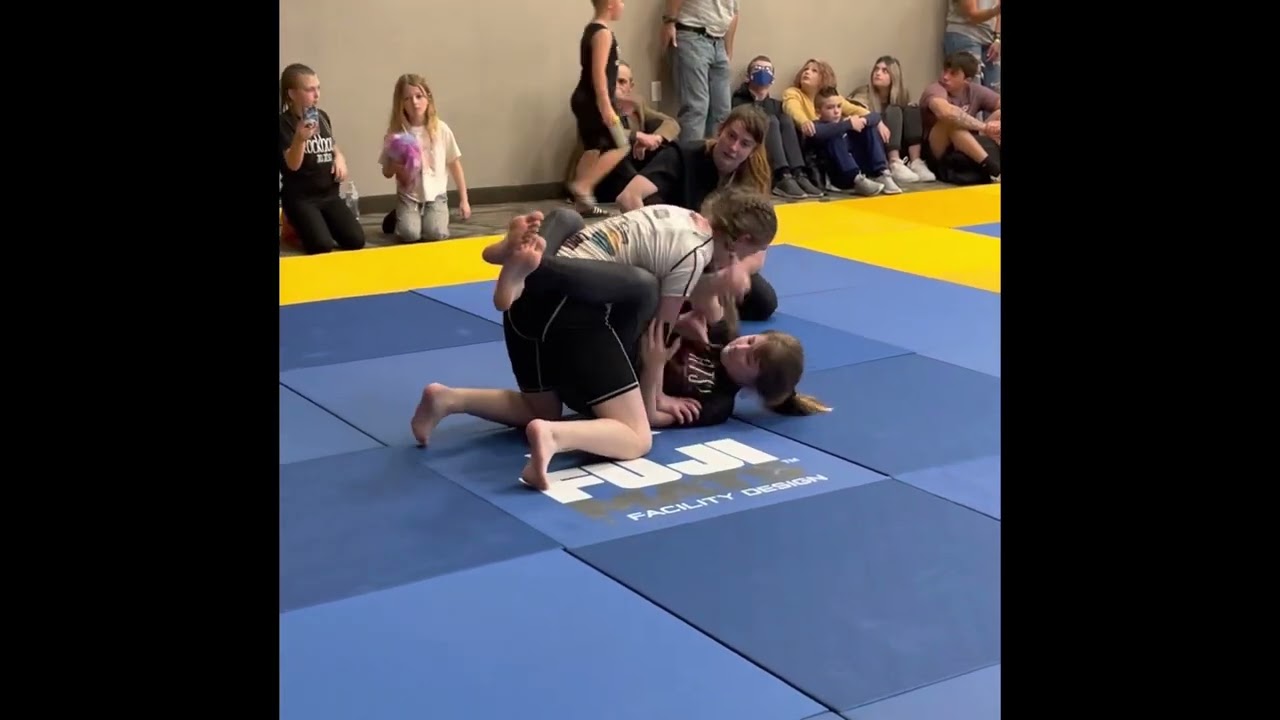 Teen girls no gi jiujitsu with armbar finish.