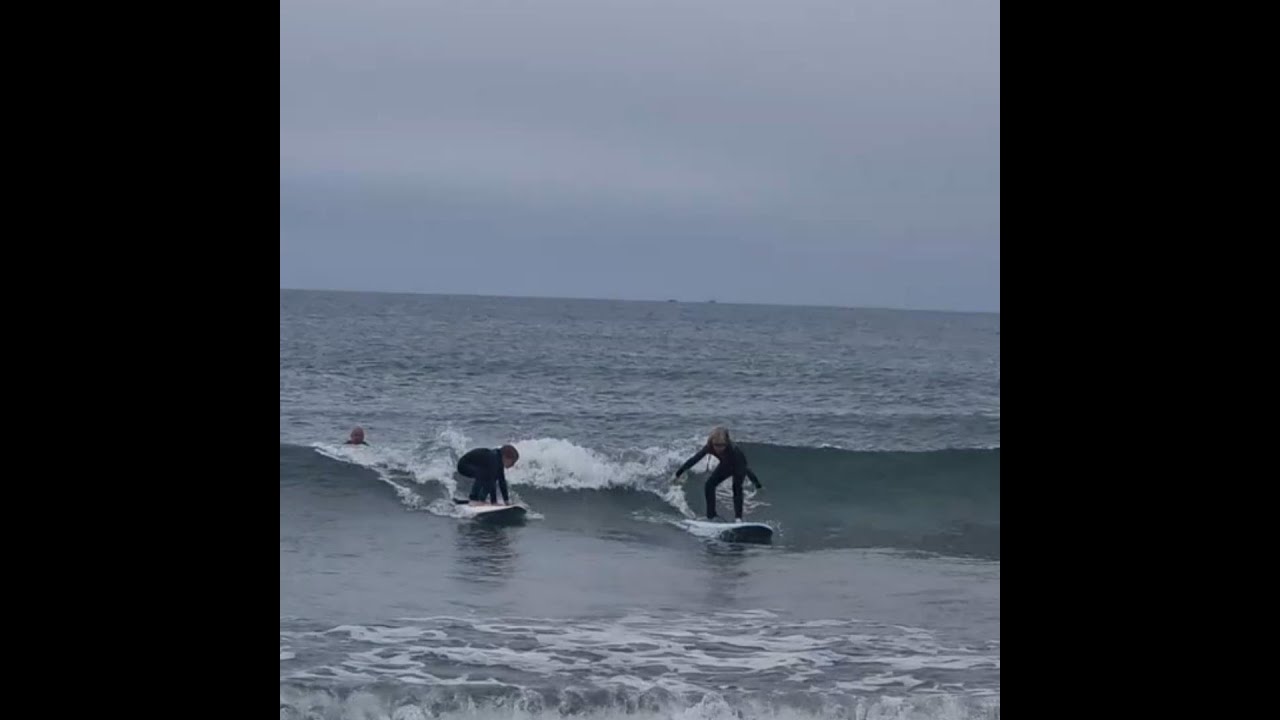 Surfing at Rhosneigr beach (Anglesey, North Wales).