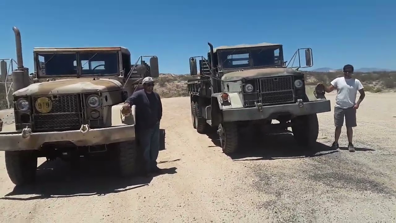 2 VIETNAM ERA DUECE AND A HALF ARMY TRUCKS GOING THROUGH THEIR PACES