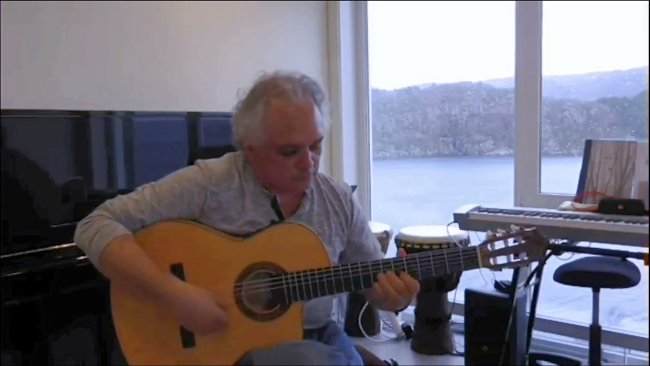 Issa Molina - Playing Guitar Accompanied by a Captivating Landscape.