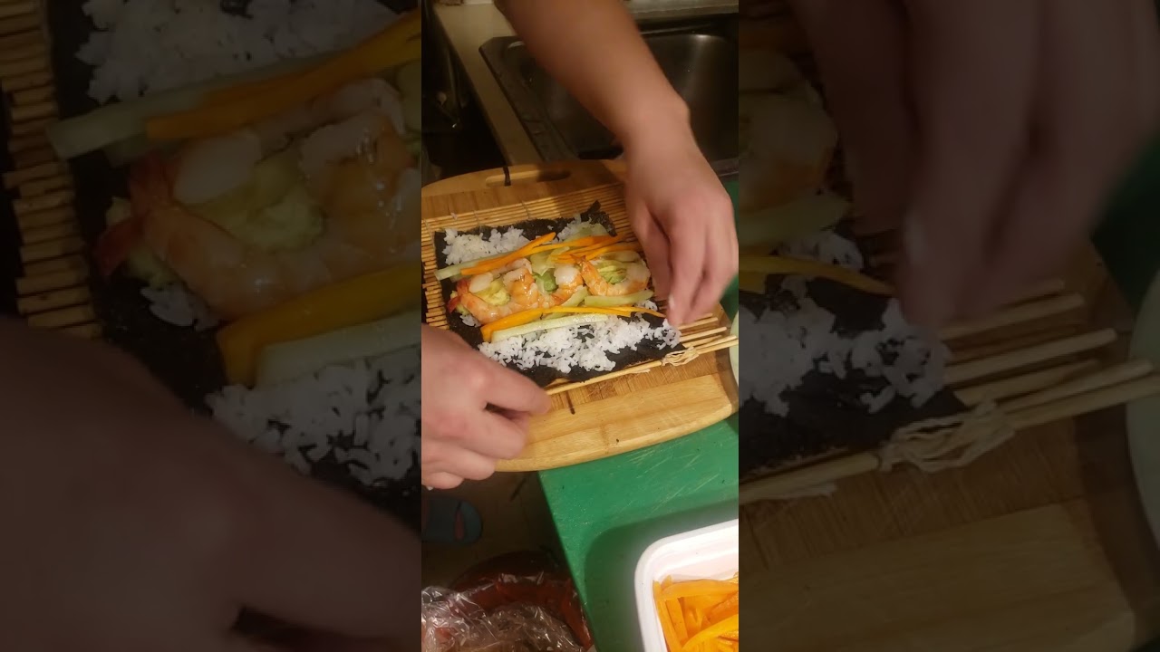 Make Sushi With Seaweed,Tiger Shrimps, Cucumbers slices,Carrot Slices,Avocadoes too With Rice Part12