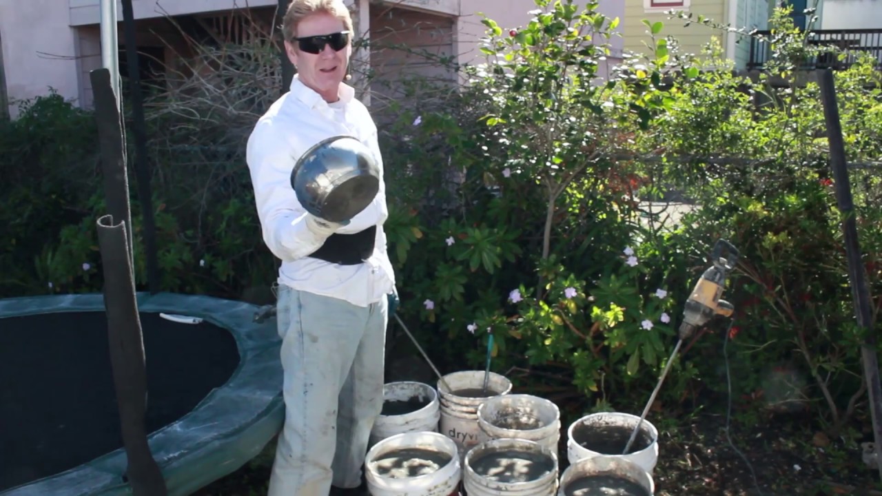 Learn to mix stucco sand and cement ratios in buckets with a drill, Collomix mortar Drill