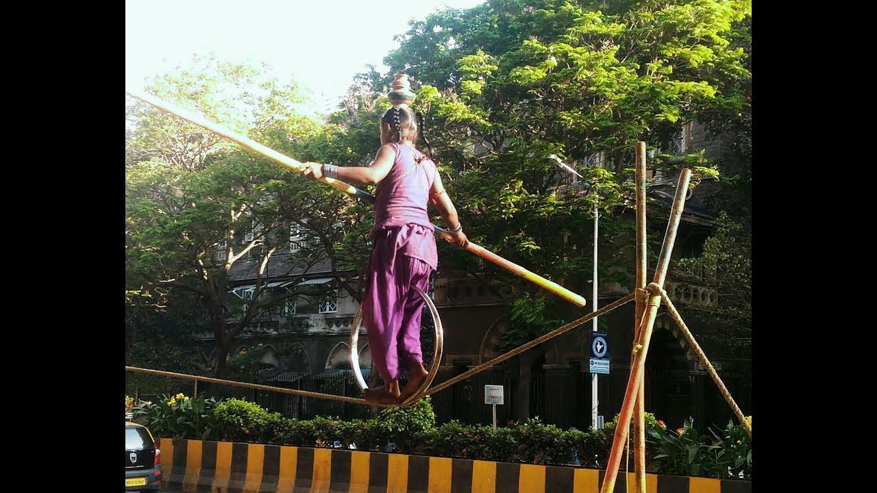 Small girl walks on a rope in Mumbai