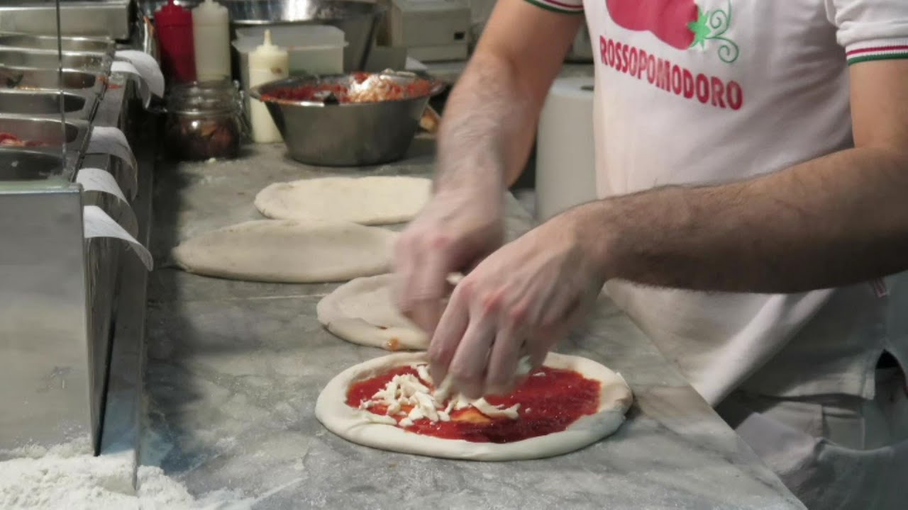 Making and Cooking a Perfect Italian Pizza, Naples Style. Italian Food seen in Italy