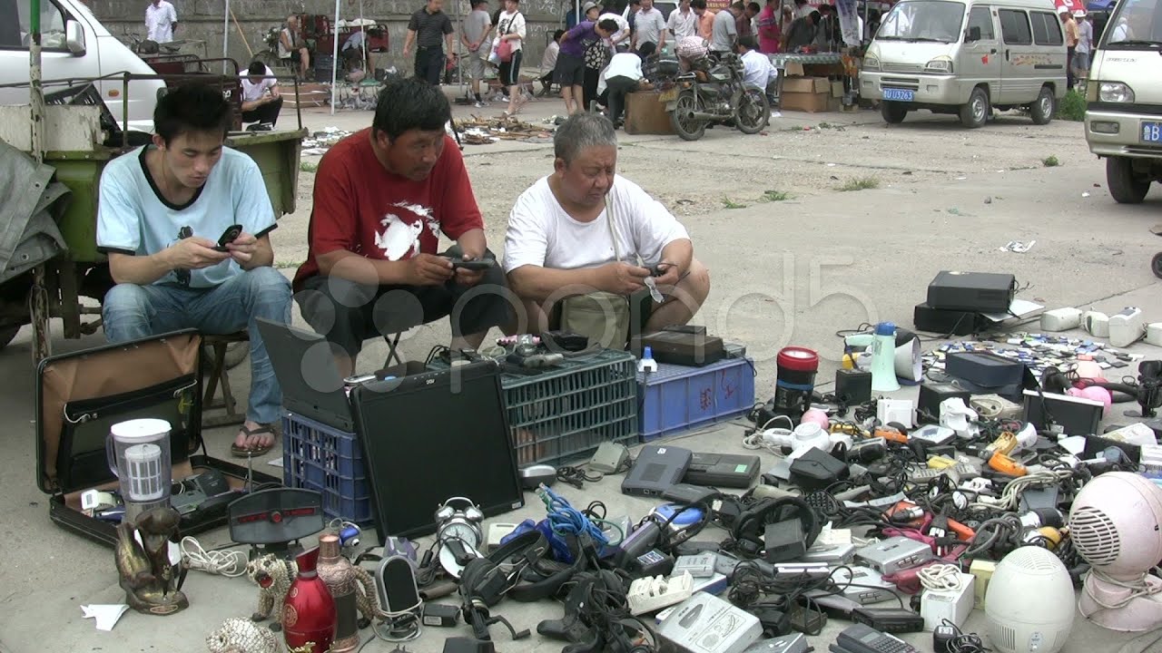 Men selling mobile phones at a second hand market in China. Stock Footage