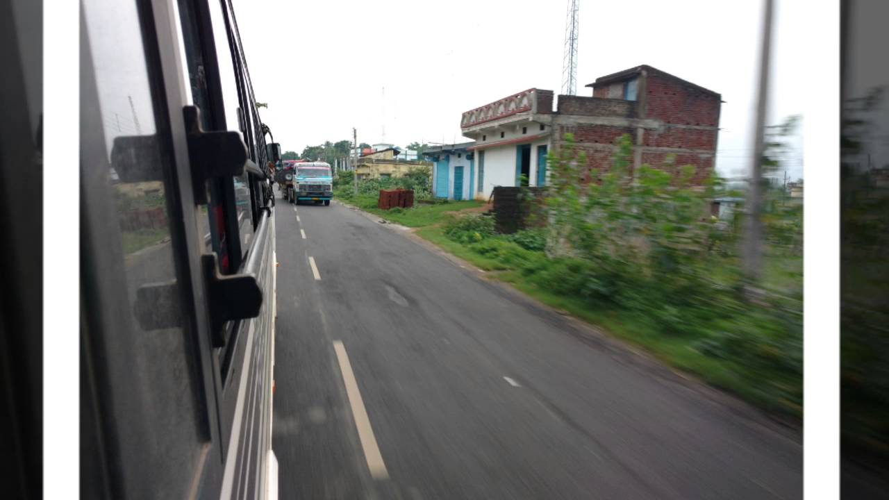 Bus rides in India and view outside the window.