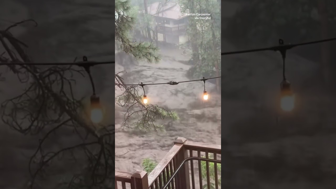 Dramatic moment house is swept down river in flash flood emergency