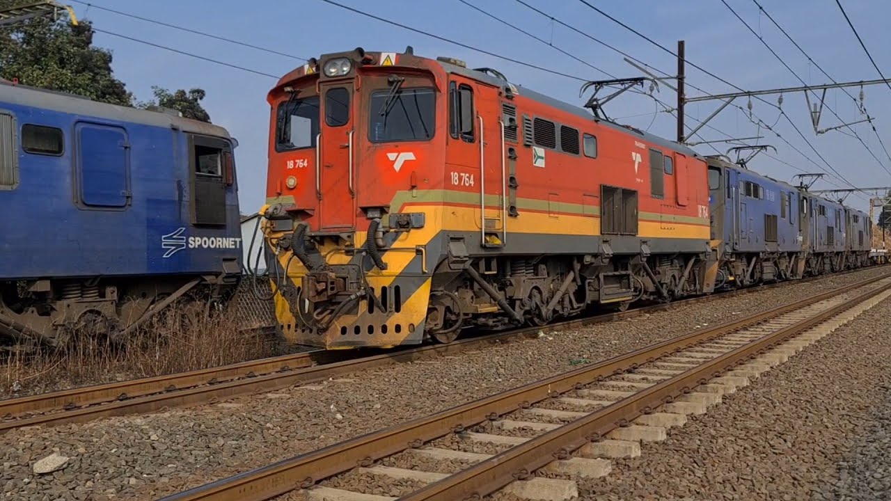 South African Railways class 18E locomotives crossing at Lions River station. A Big struggle.