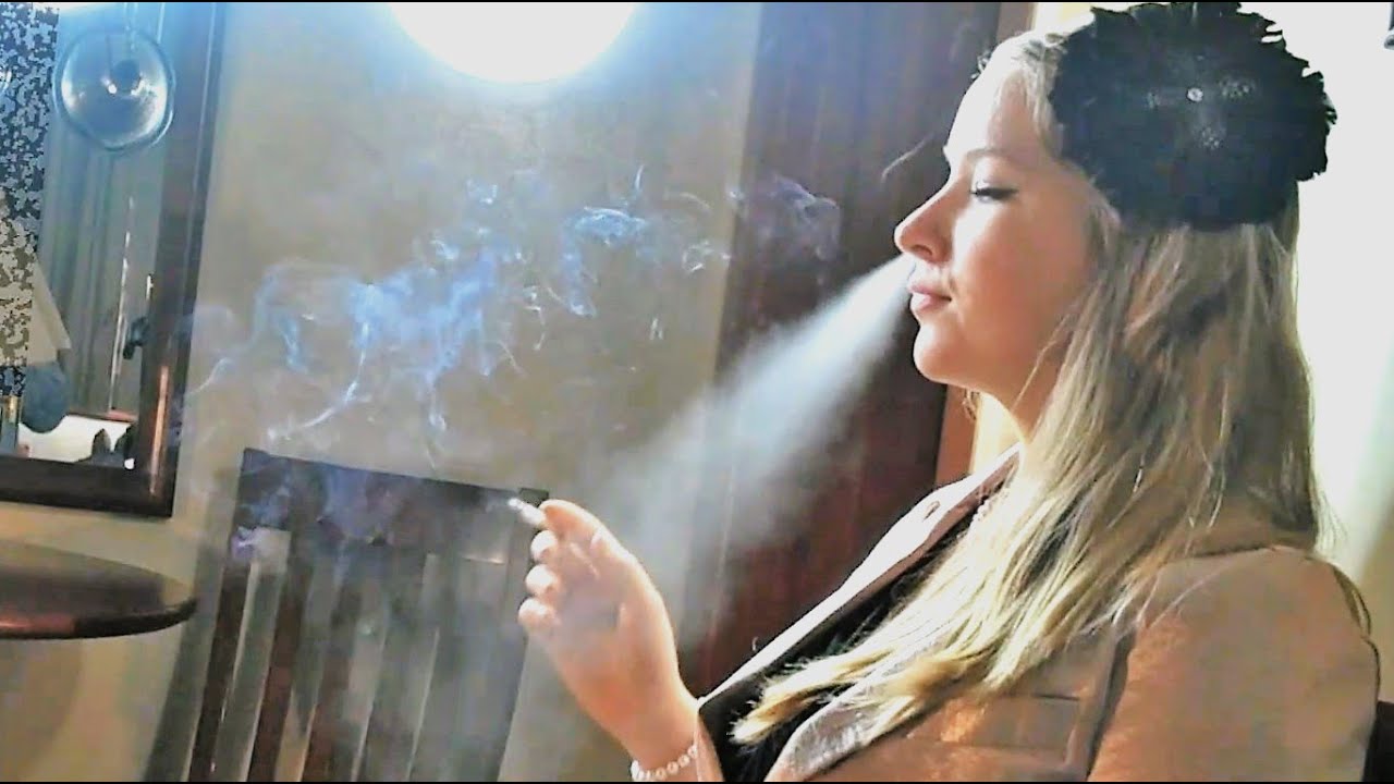Blonde Woman Destroying With Pleasure Her First Smoke of the Day