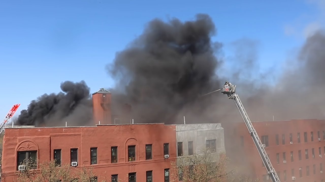 8th ALARM !! HEAVY FIRE through the ROOF !! FDNY battles DEVASTATING fire in Jackson Heights, Queens