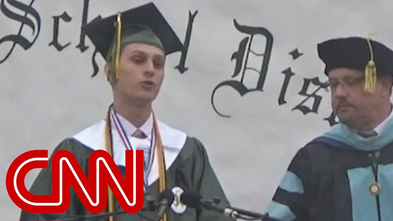 Valedictorian's mic cut after he bashes school