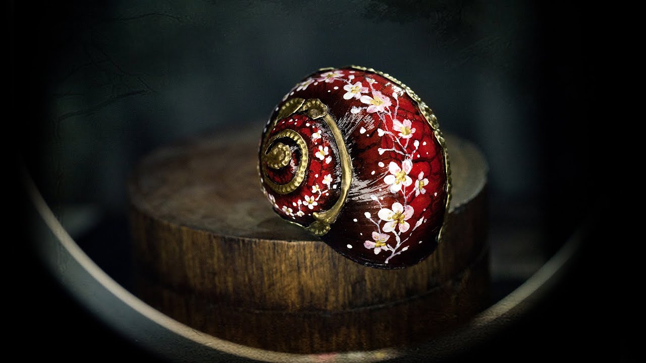 Acrylic painted Snailshell with white flowers and metallic applications