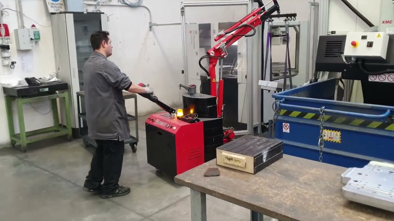 AXA Flexlifting ORBIT 500E counterbalanced crane at work cnc machine video