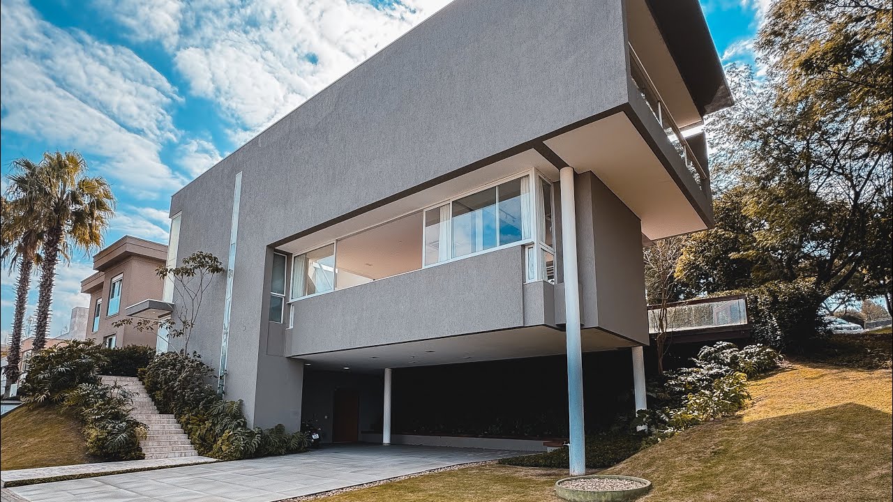 MANSÃO DE R$ 8,5 MILHÕES EM FRENTE À RESERVA | 774m², 4 SUÍTES, PISCINA COM SPA E AUTOMAÇÃO