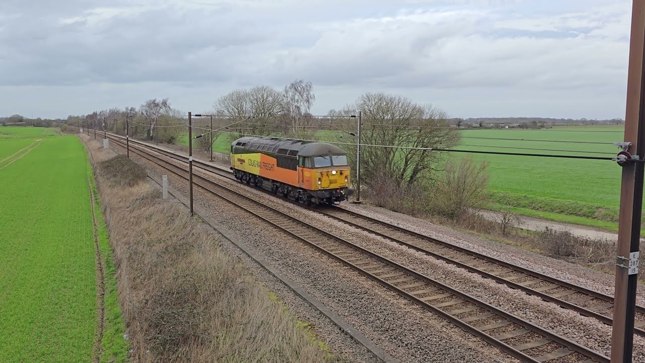 Colas Rail Class 56 number 56049 Named (Robin of Templecombe) at speed on the East Coast Main Line