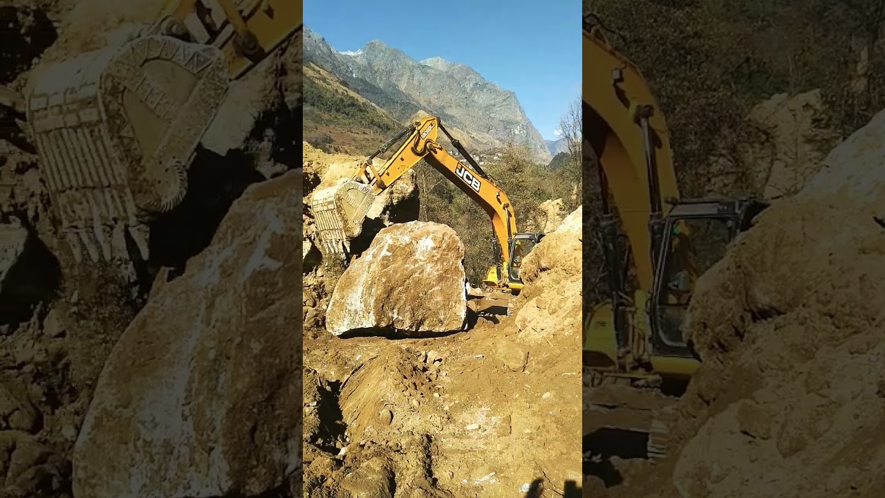 shifting #big #rock #boulder #road #construction work in progress