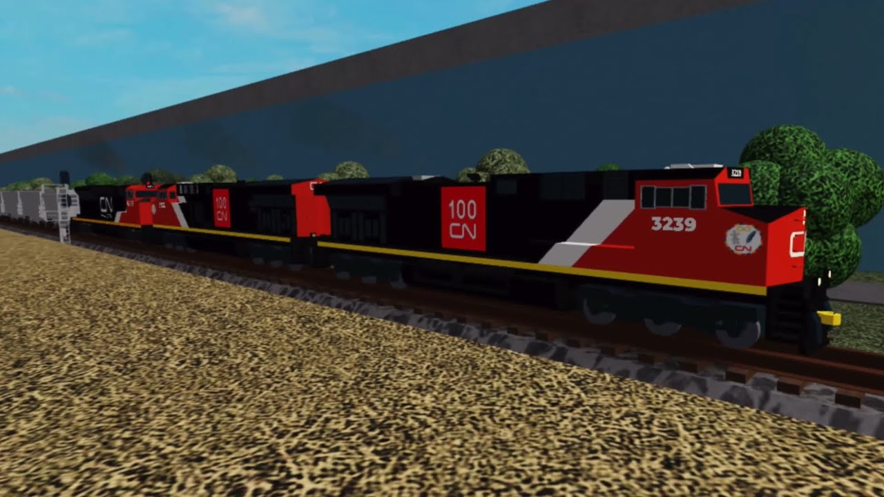 Two CN ET44ACs leading on CN Hopper Train