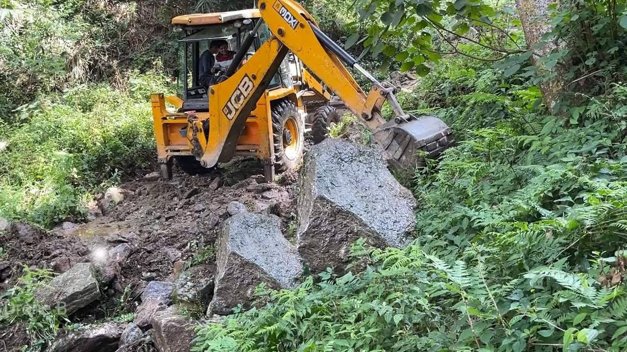 Removing Boulders and Stones from Steep Mountain River