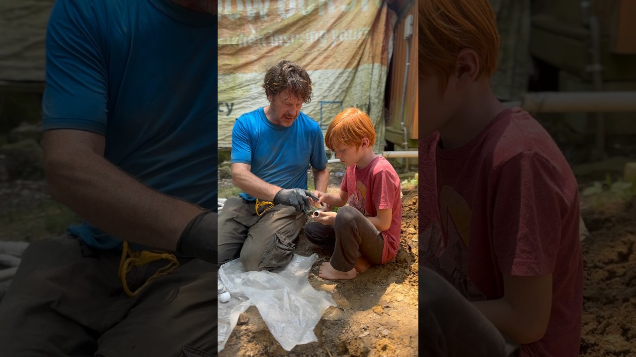 Father & Son work on solar outdoor plumbing 