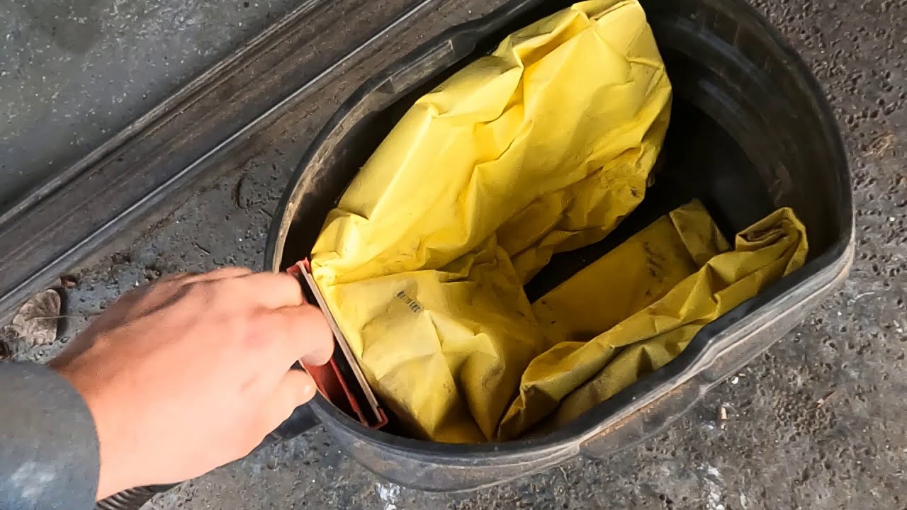 Shop Vac hack for reusing collection bag