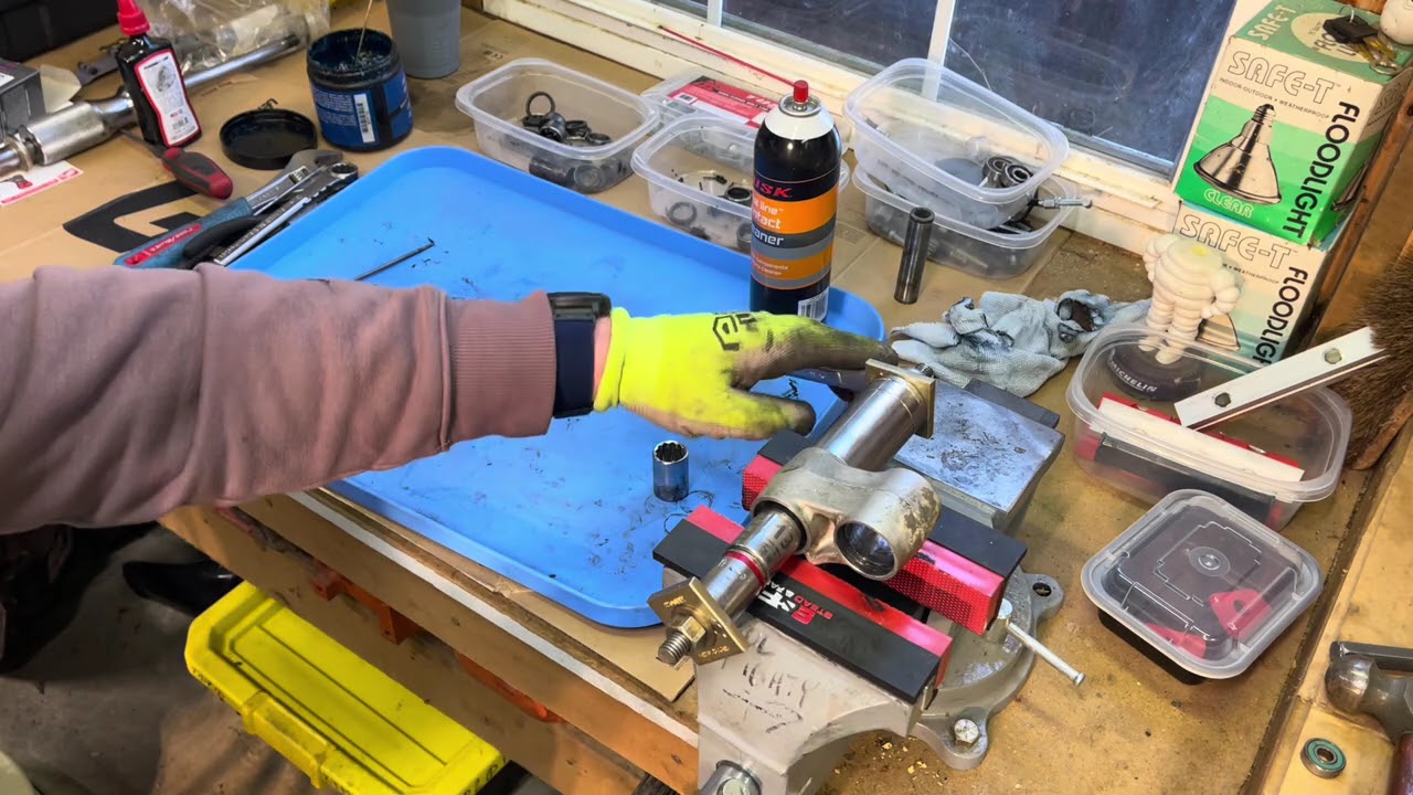 Removing suspension bearings on dirt bike using sockets and items from Home Depot and Lowes.