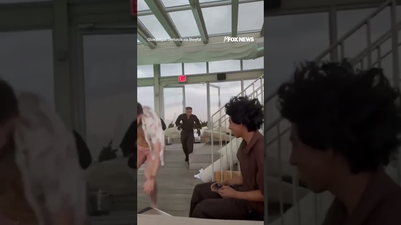 One minute people were relaxing by the pool, then they were running for cover