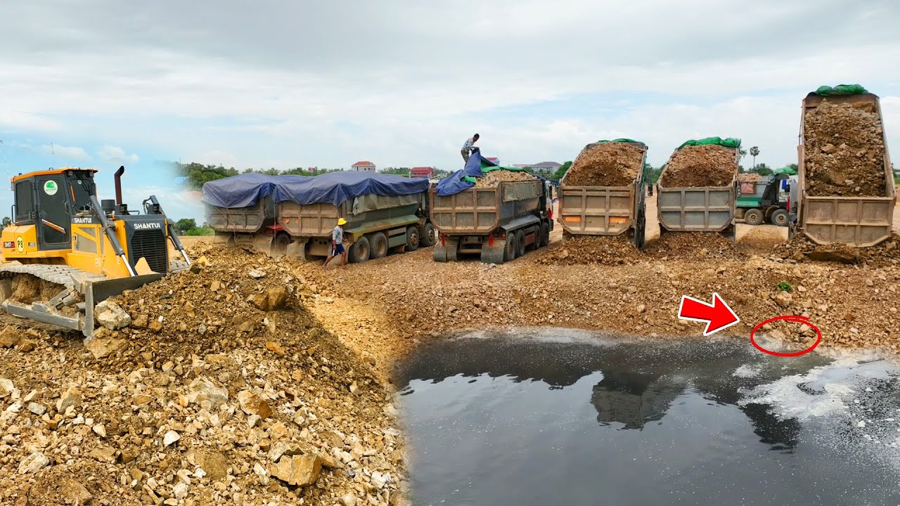 Wonderful Complete Soil Filling by Two Skills SHANTUI Dozer Pushing Rock And several rock trucks