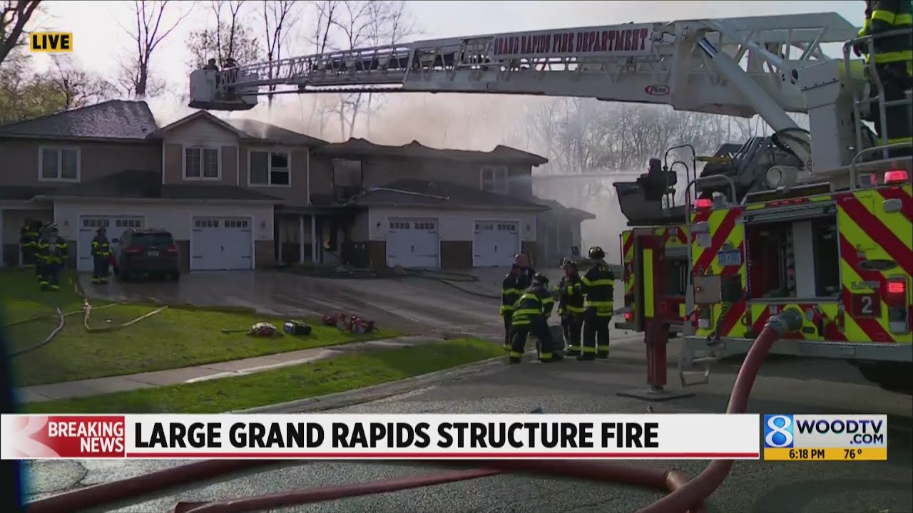 Firefighters work to put out flames at multiplex in Grand Rapids