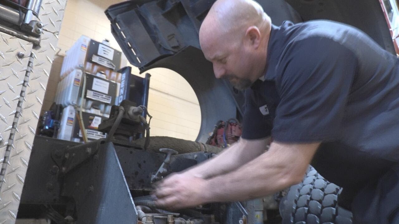 Under the fire engine with Sioux City Fire Rescue’s only mechanic