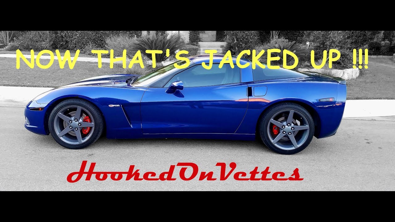 Jacking up C6 Corvette with floor jack and jack stands.