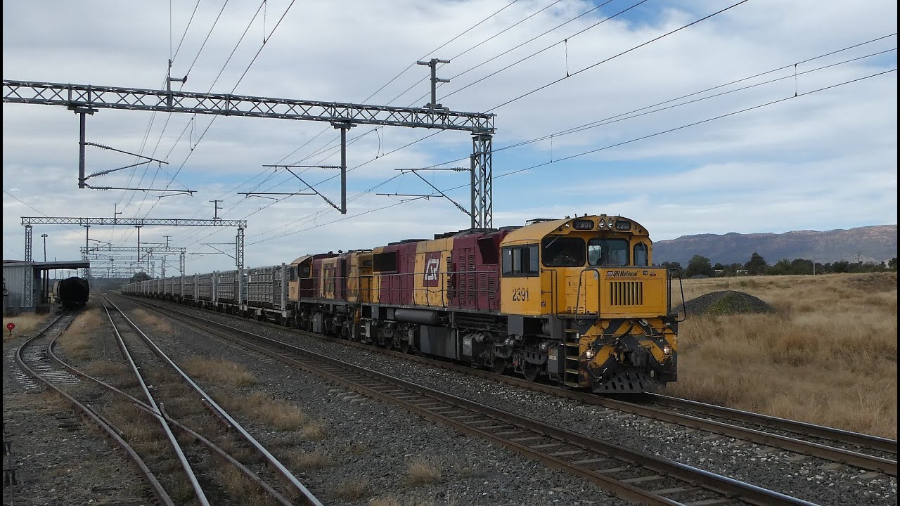 An Aurizon Cattle Train and Railway Maintenance Vehicles at Blackwater Queensland.