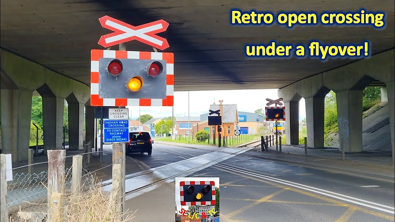 Unique open crossing under a flyover in Dereham: Yaxham Road Level Crossing, Mid Norfolk Railway