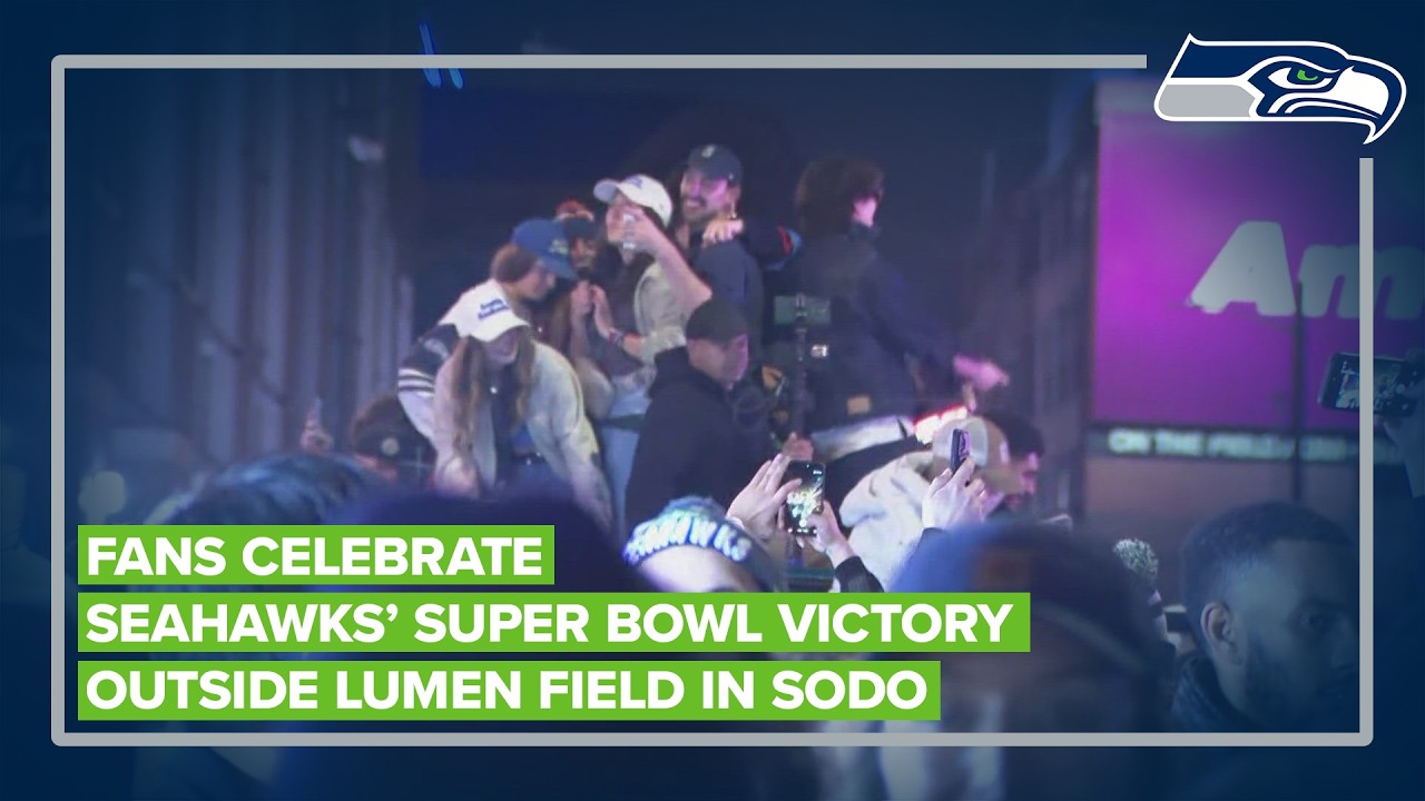 Fans celebrate Seahawks' victory outside Lumen Field in SODO