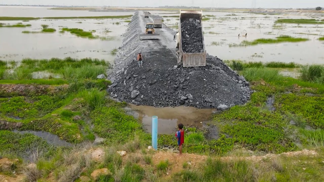 Great Techniques Build Road on Water Using Bulldozer Push Stone and Dump Truck Unloading Stone Fill