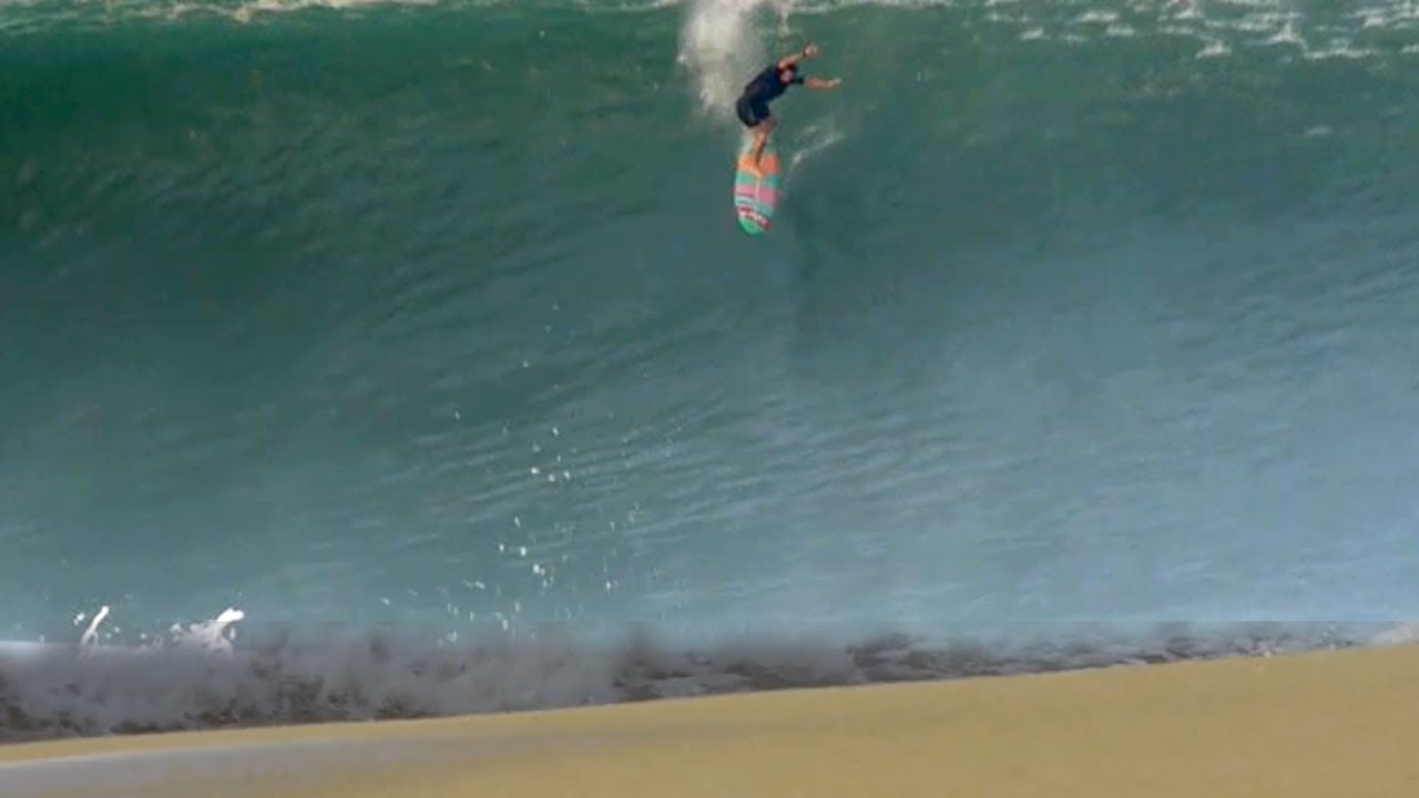 Surfers Attempt To Ride The Biggest Swell To Ever Hit This Beach (Raw Footage)