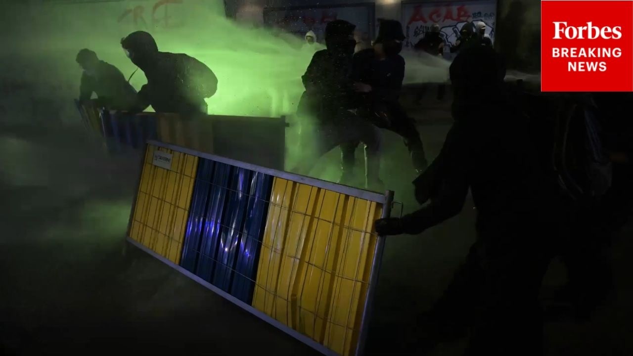 RAW VIDEO: Police Blast Protestors With Water Cannons Amid Cost Of Living Concerns In Belgium
