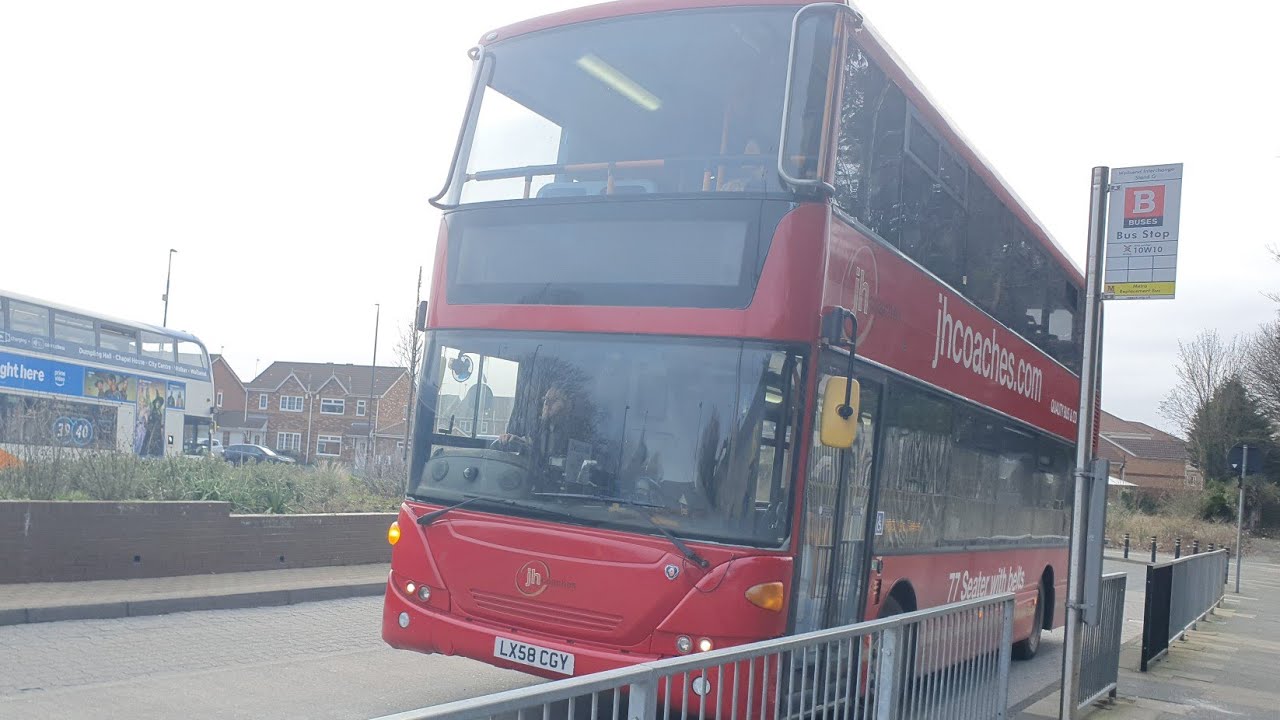 Nowt to say: LX58 CGY JH Coaches Scania Omnicity On The 900