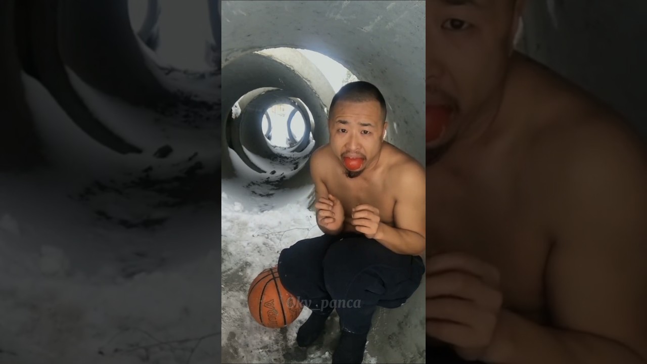 Homeless man eating tomatoes in very cold weather