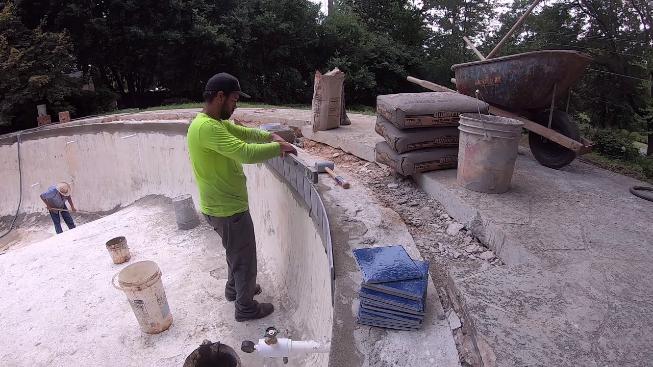 AQUAMASTER POOLS  TILE AND COPING INSTALL