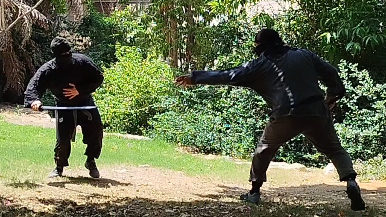 throwing shurikens in asword fight