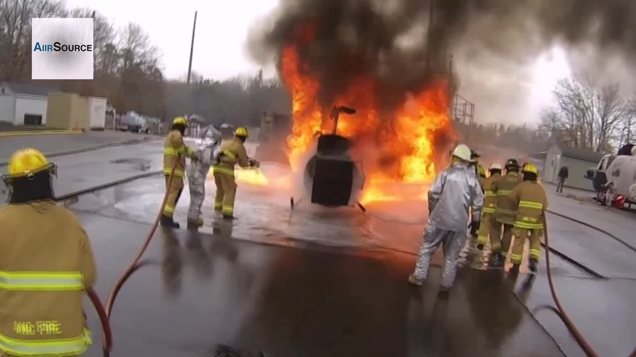 U.S. Air Force Fire Protection Specialists Battle Simulated Aircraft Fire