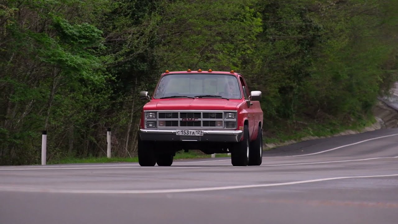 Little dog and big red truck