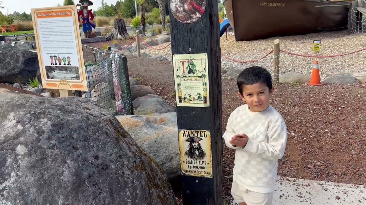 Kid goes to playground rocket race car and pirate ship fun and very cool |