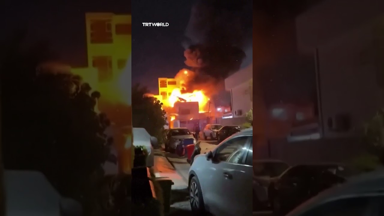 Explosions rock burning building in Baghdad after air strikes